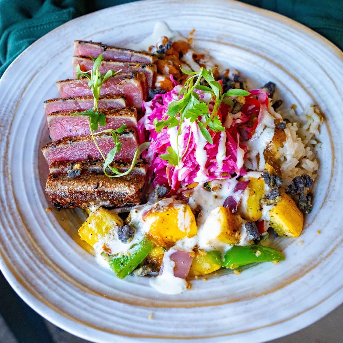 High Marea’s Santa Cruz Bowl with seared tuna, rice, grilled vegetables, pickled cabbage and crema